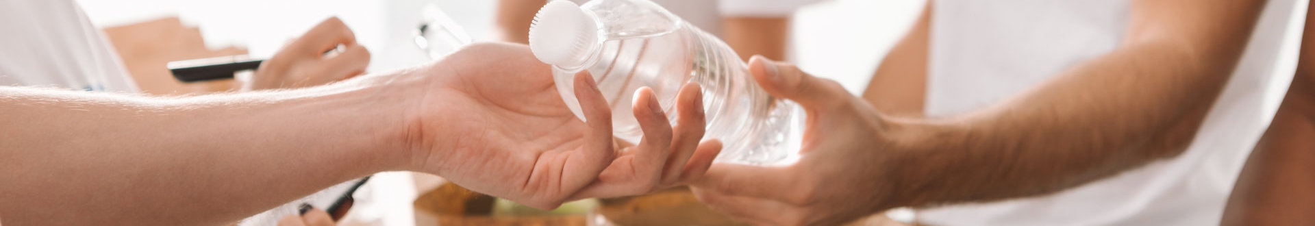 woman handing water